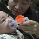 A baby receives inhalation therapy in Beijing on January 28, 2013.